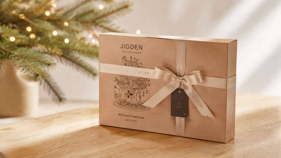 A beautifully wrapped Christmas 3D puzzle gift box sitting on a wooden table, perfect for the holiday gifting season.