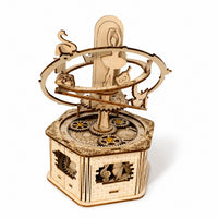 Assembled Orbiting Ballerina 3D wooden puzzle music box on white background