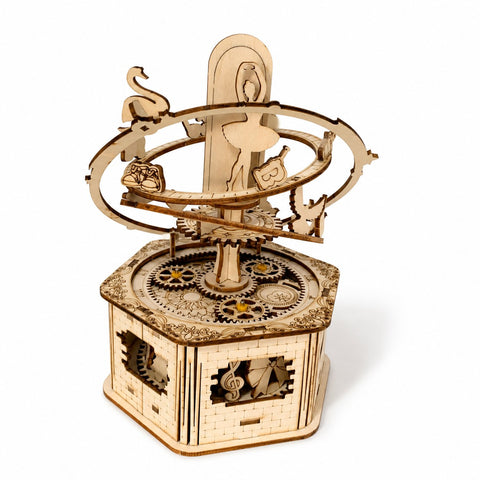 Assembled Orbiting Ballerina 3D wooden puzzle music box on white background
