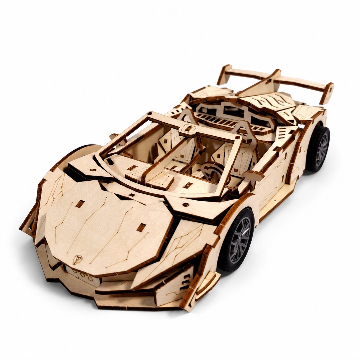 Assembled wooden convertible supercar model kit on white background