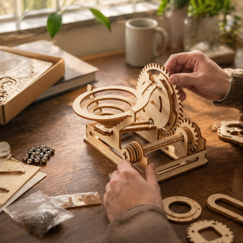 Adult assembling wooden marble run puzzle