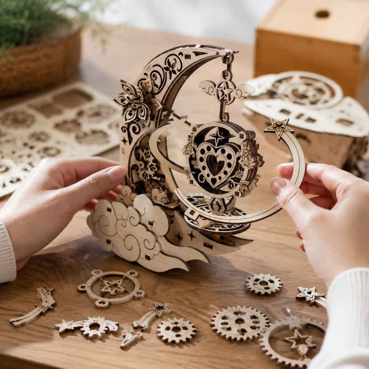 Person assembling the wooden mechanical music box kit