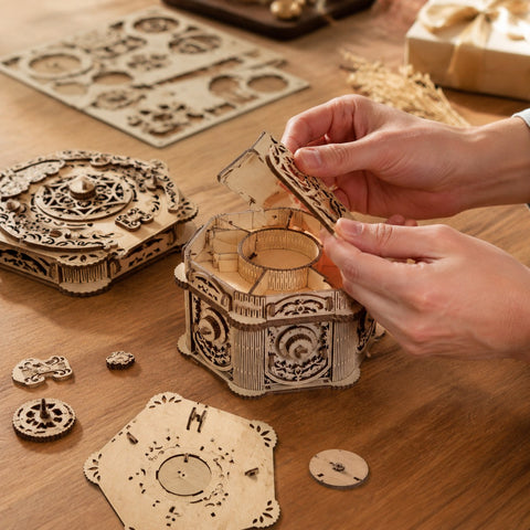 Person assembling the Mechanical Jewelry Box 3D Wooden Puzzle