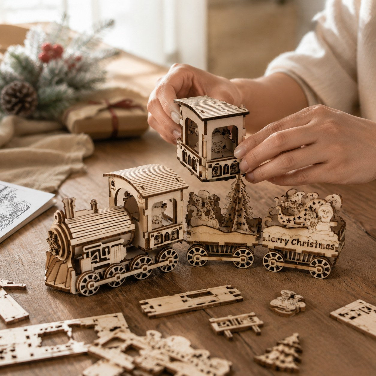 Hands building the wooden Christmas train puzzle