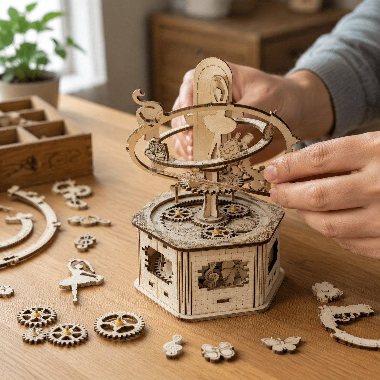 Adult hands assembling the wooden gears of the ballerina music box