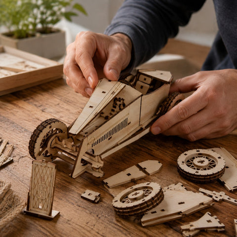 Adult hands assembling the Vintage Grand Prix Race Car 3D Wooden Puzzle on a workbench