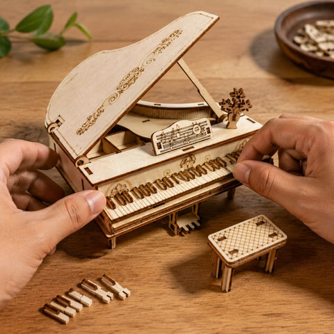 Adult hands assembling the wooden grand piano puzzle on a workbench