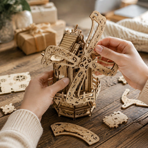 Person assembling the wooden windmill house puzzle