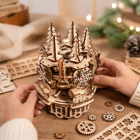 Person assembling the wooden Christmas carousel puzzle