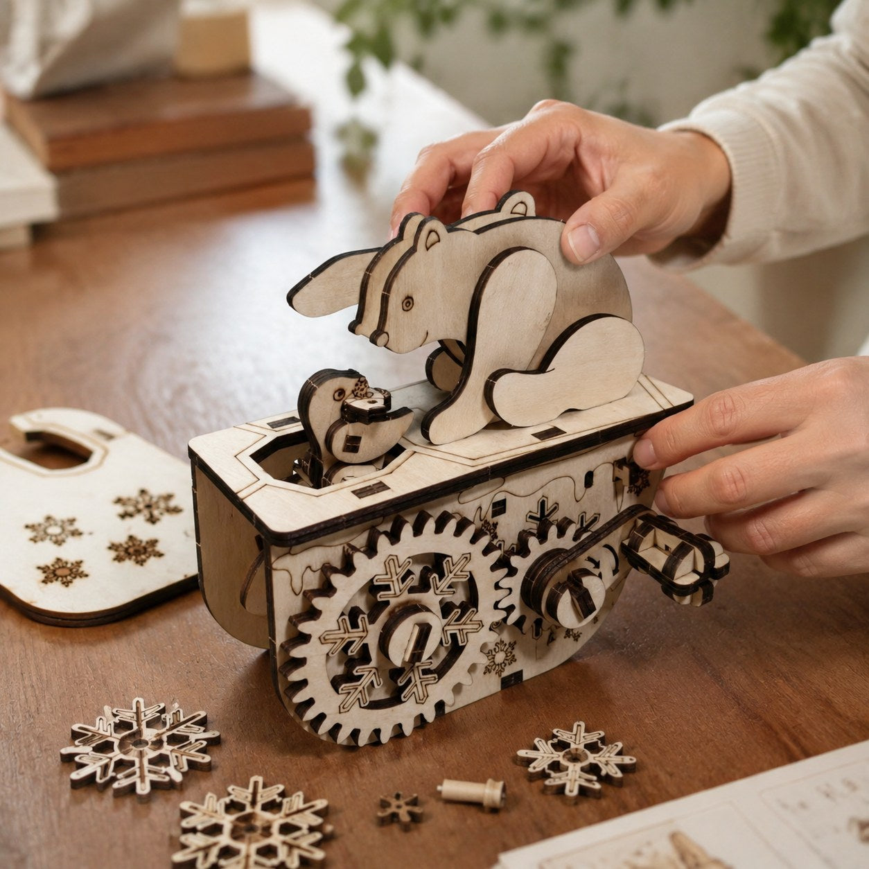 Adult hands assembling the gears of the Polar Bear 3D Wooden Puzzle