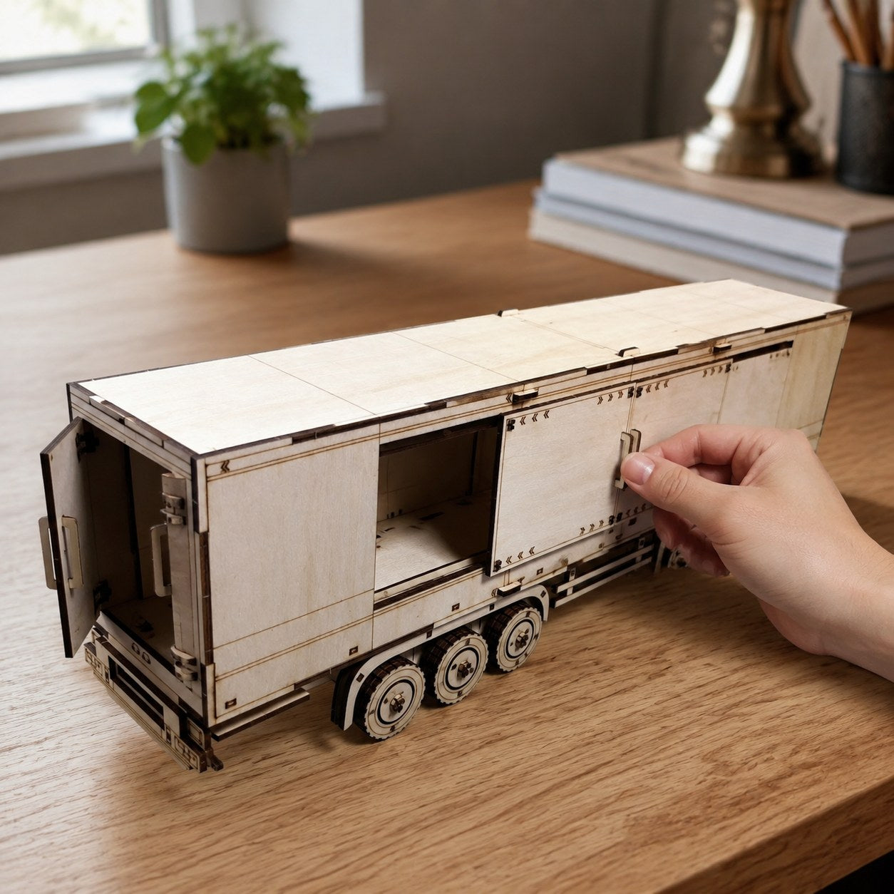 Hand adjusting the wooden semi-trailer model