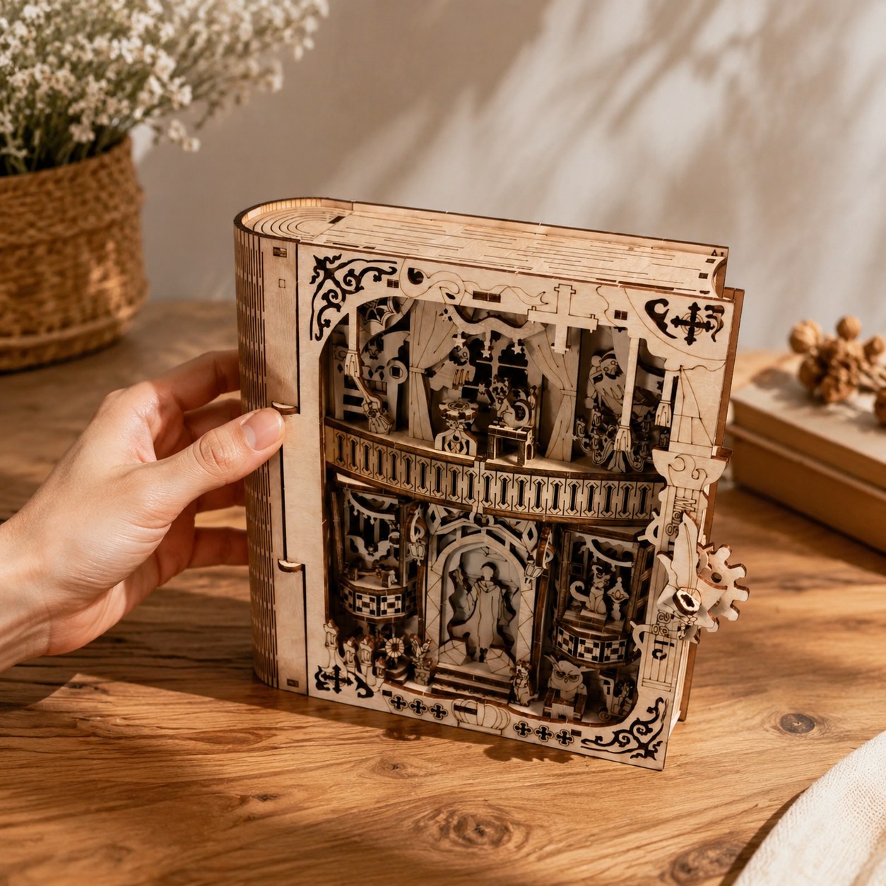 Hand opening the secret storage compartment of the wooden book box