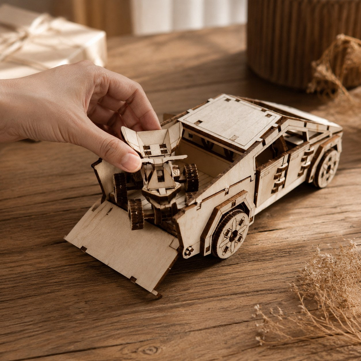 Hand placing wooden ATV into the back of the cyber-style truck model