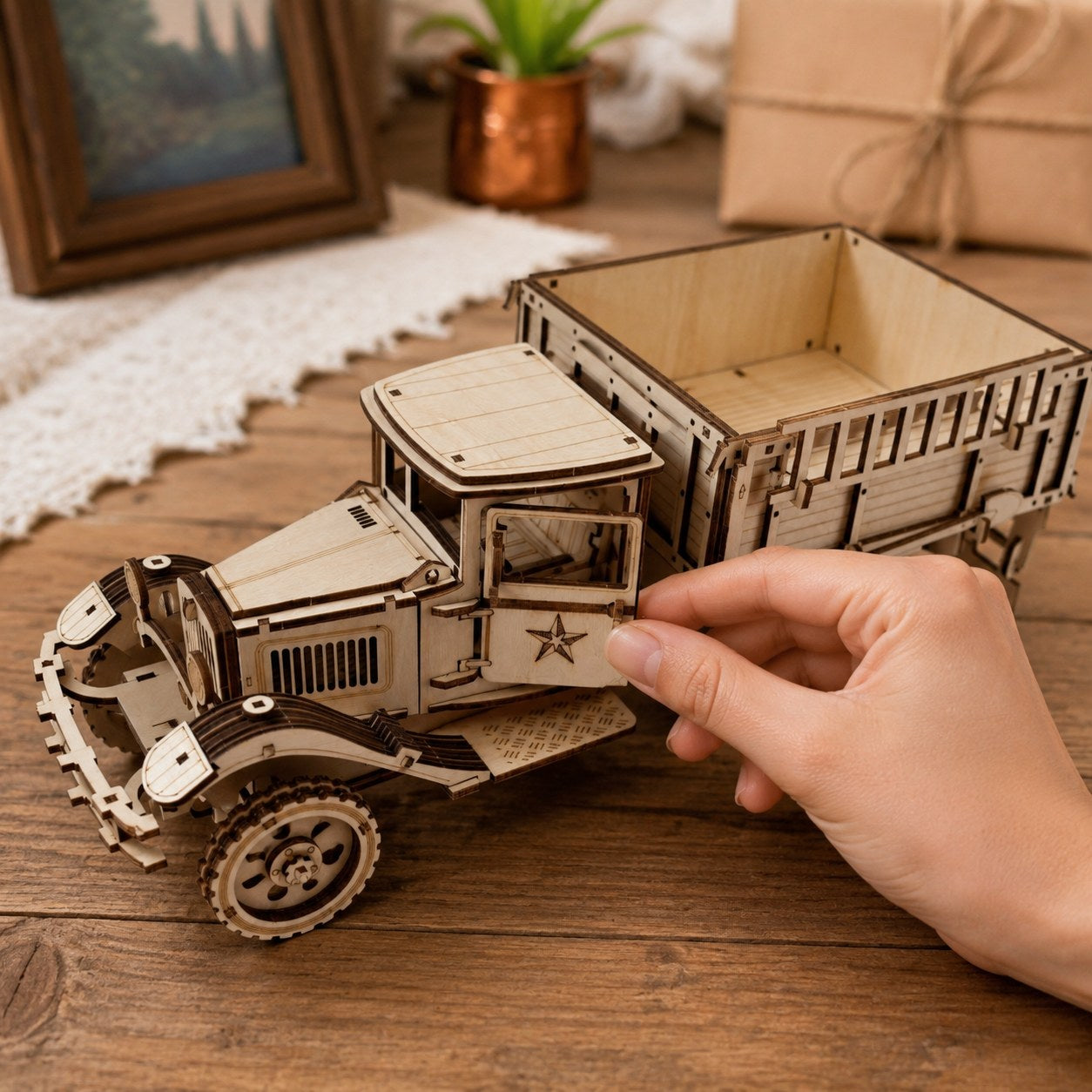 Hand interacting with the Vintage Cargo Truck model to show scale