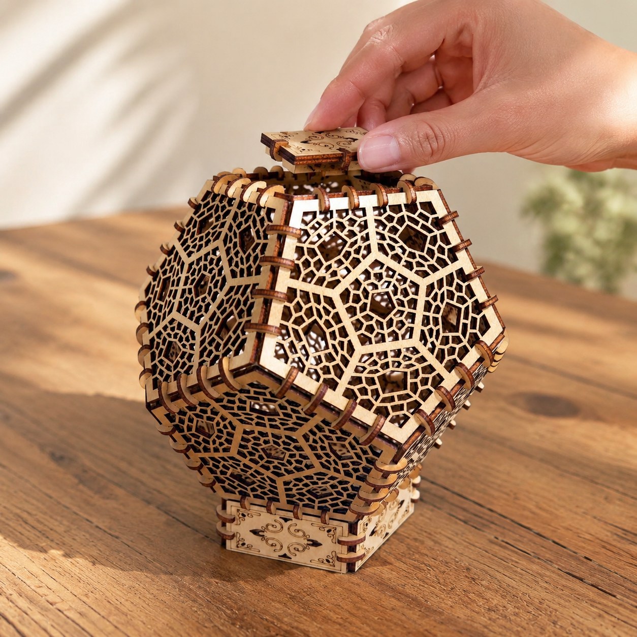 Hand adjusting the finished 3D wooden lantern