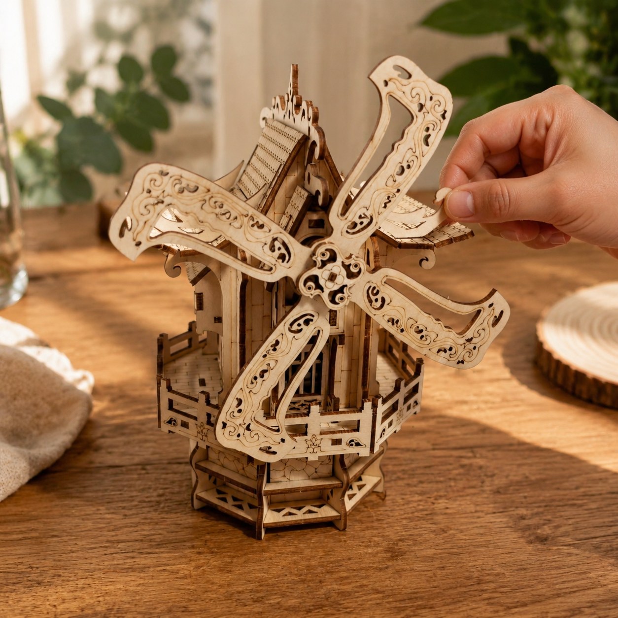 Hand adjusting the finished 3D wooden windmill model