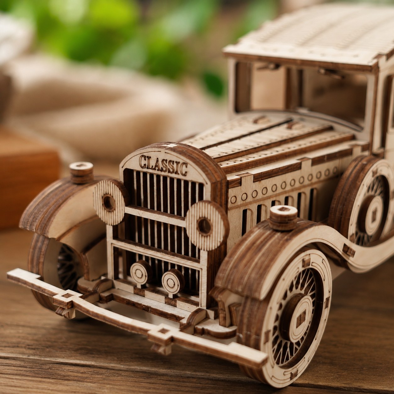 Close-up detail of the wooden spoked wheels and front grille