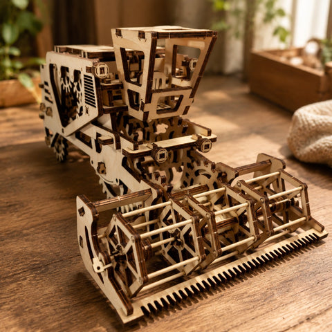 Close-up of interlocking wooden gears on the harvester model