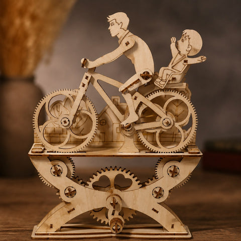 Close-up of interlocking wooden gears on the bicycle model