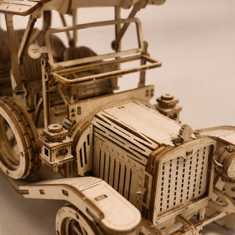 Close-up detail of the laser-cut wood pieces on the Retro Roadster Mechanical Wooden Car Kit.
