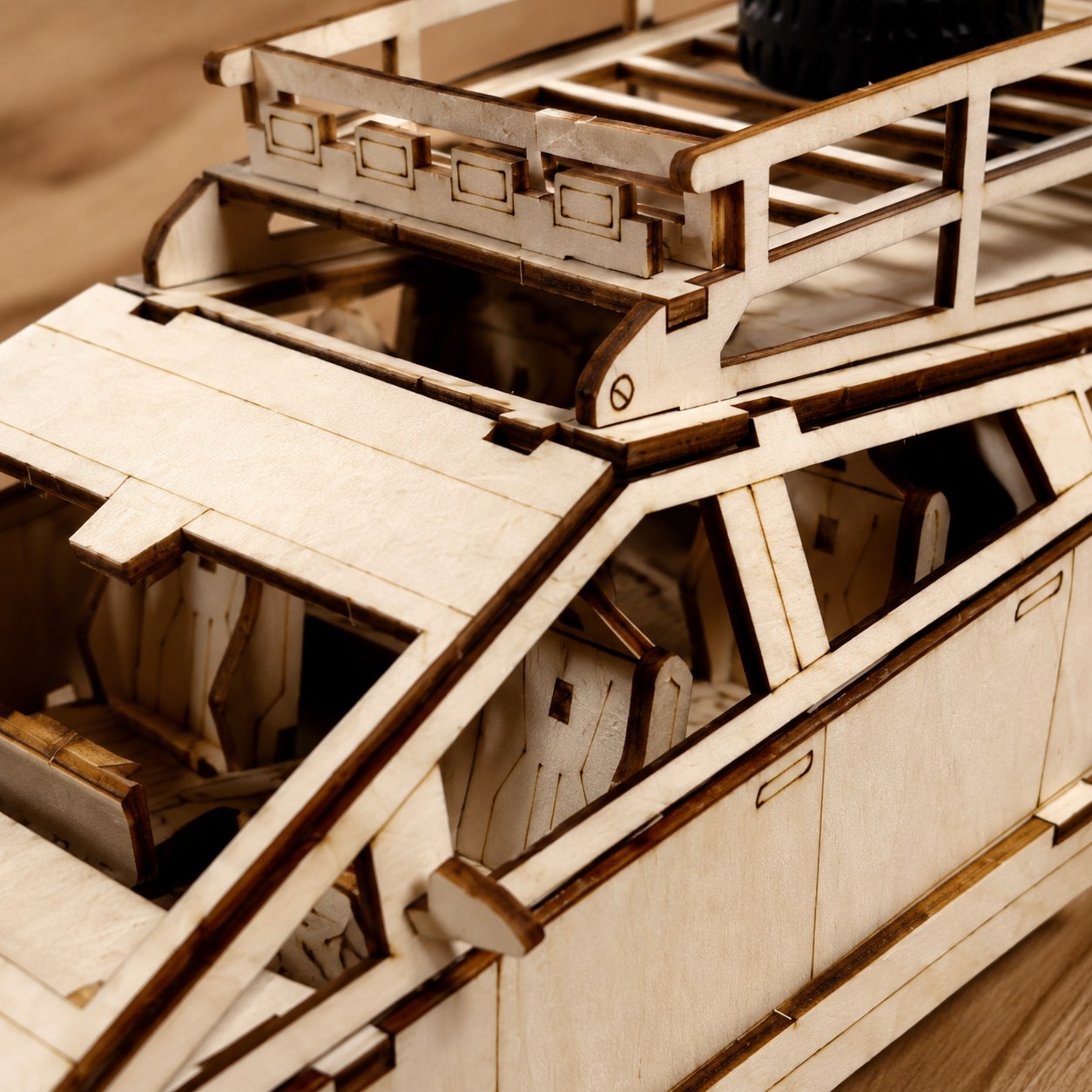 Macro close-up of the laser-cut wood details on the futuristic pickup truck puzzle