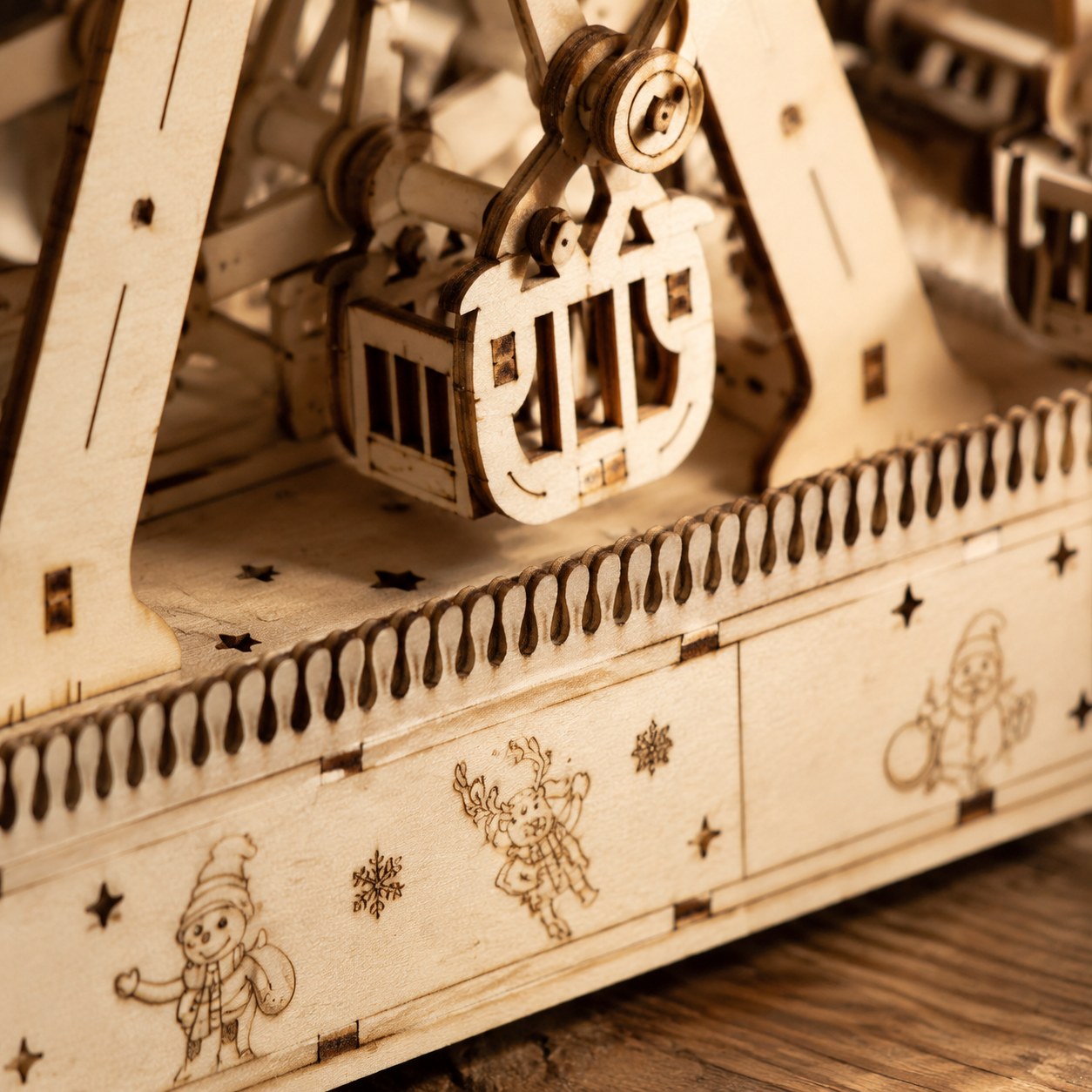 Close-up detail of the laser-cut gears and joints on the Ferris wheel puzzle