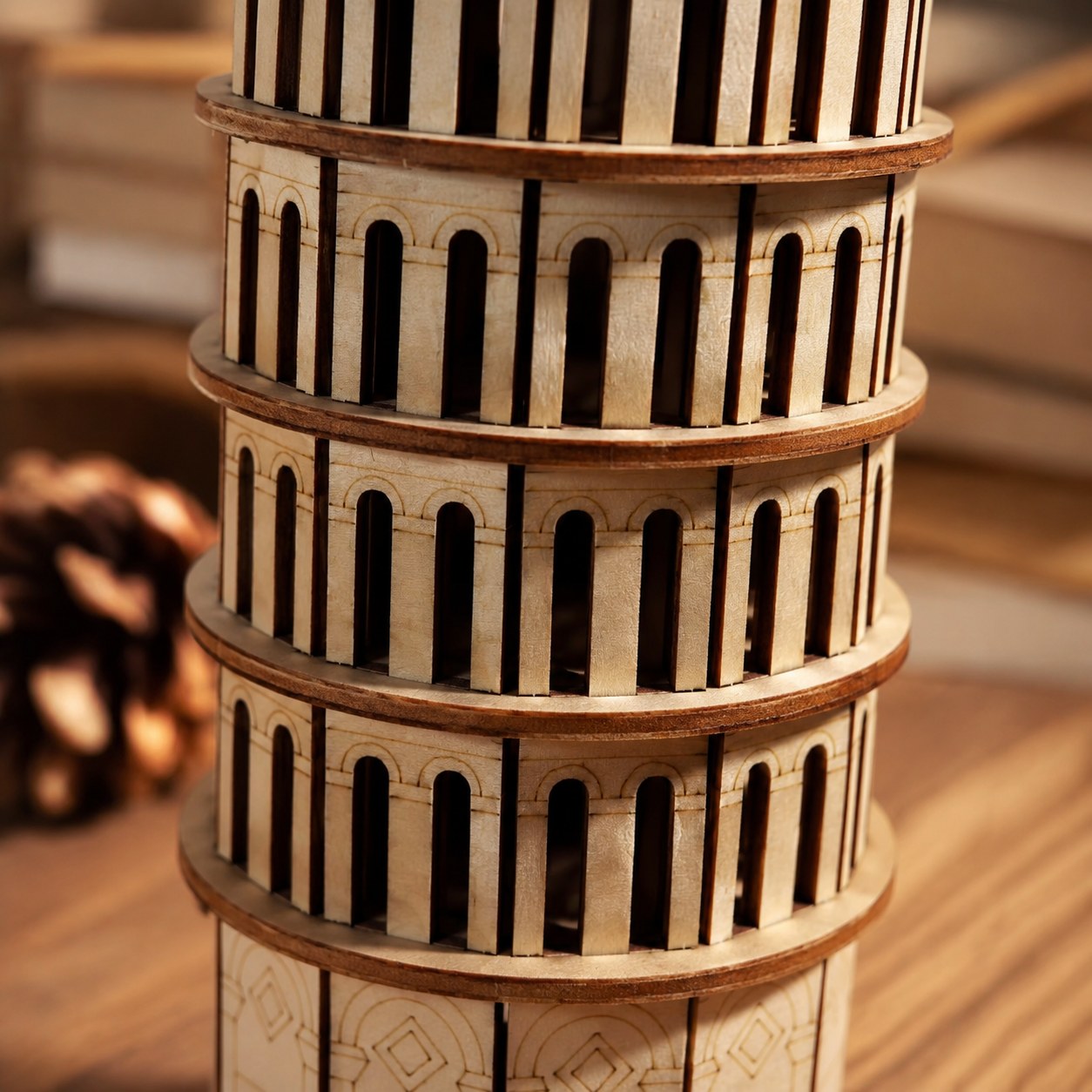 Close-up of the laser-cut wood details and arches on the Leaning Tower of Pisa puzzle