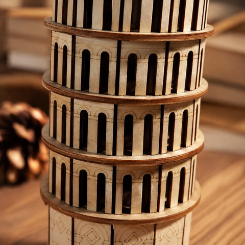 Close-up of the laser-cut wood details and arches on the Leaning Tower of Pisa puzzle