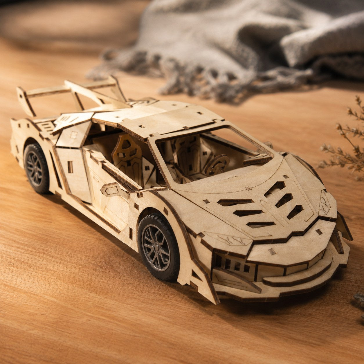 Close-up of laser-cut wood details on the supercar puzzle