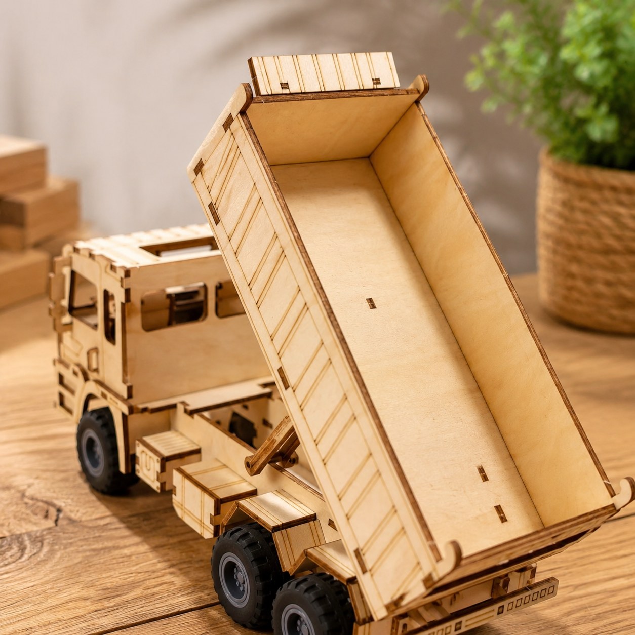 Close-up of laser-cut details on wooden dump truck