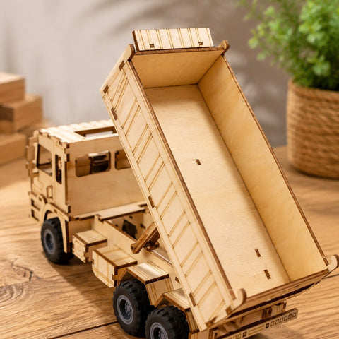 Close-up of laser-cut details on wooden dump truck