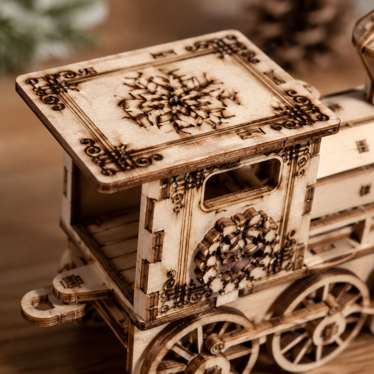Macro close-up of laser-engraved snowflake details on the wooden train