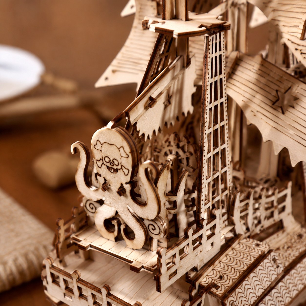 Macro close-up of the kraken figurehead and laser-cut sails