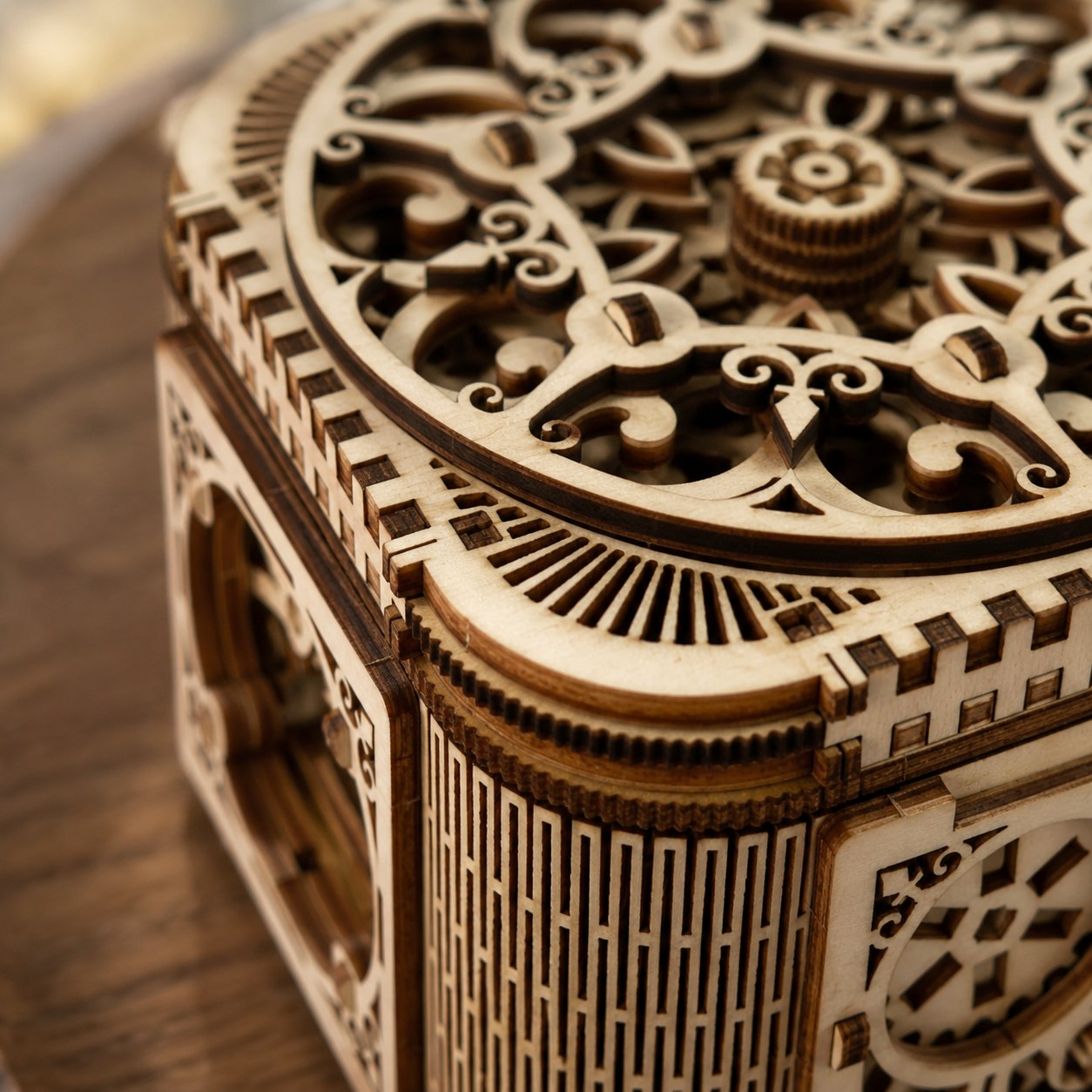 Close-up of laser-cut filigree and living hinge on wooden puzzle box