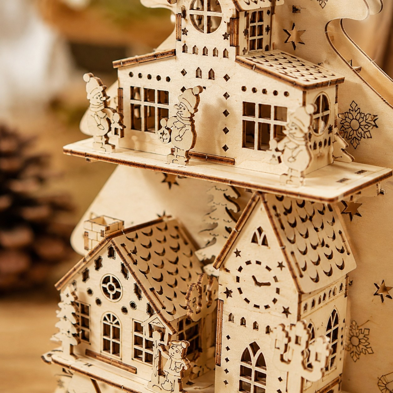 Macro close-up of the laser-cut details and etched snowflakes on the wooden puzzle