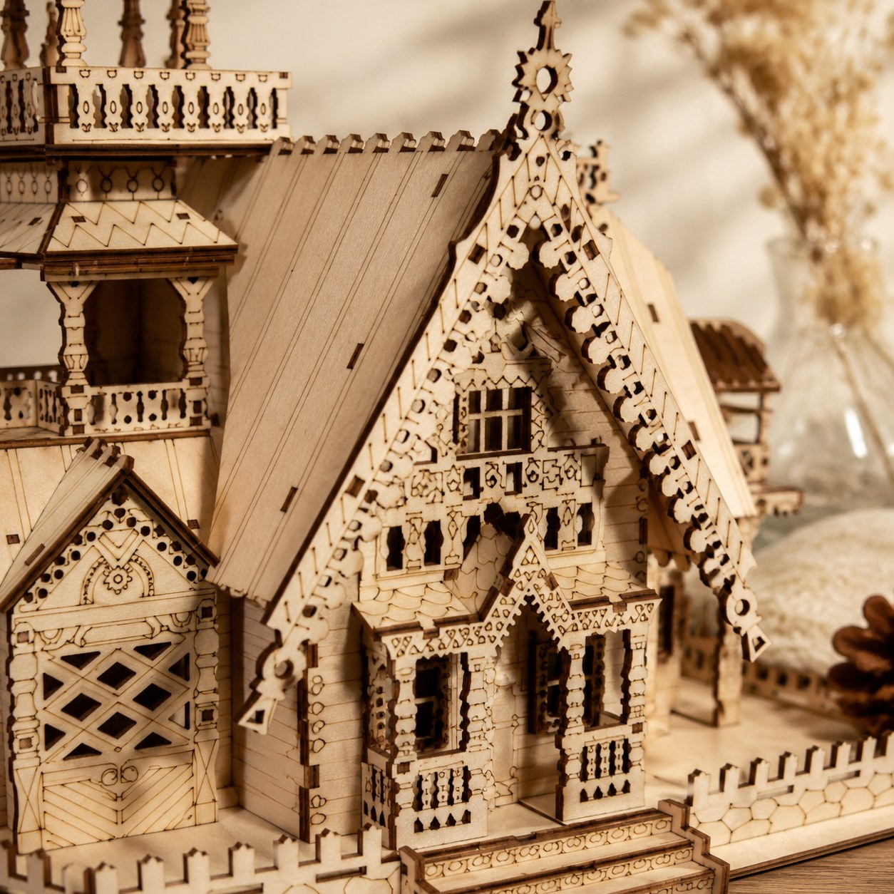 Close-up of laser-cut details on the wooden manor puzzle