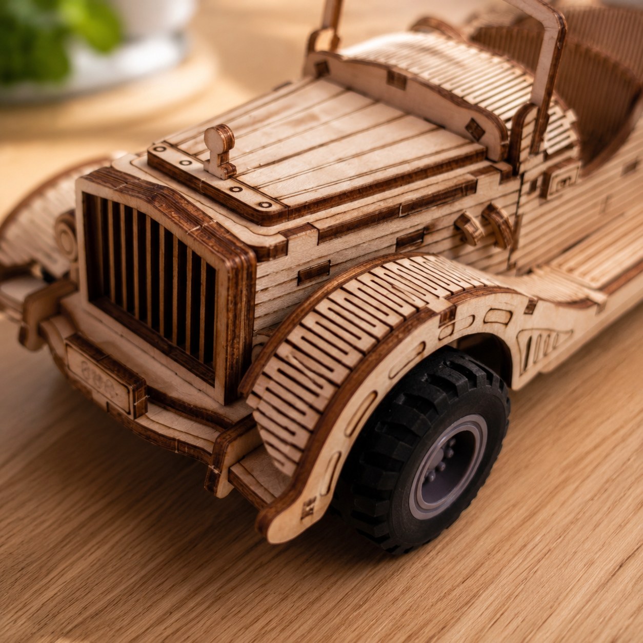 Macro close-up of laser-cut living-hinge wood details on the Vintage Convertible Car model