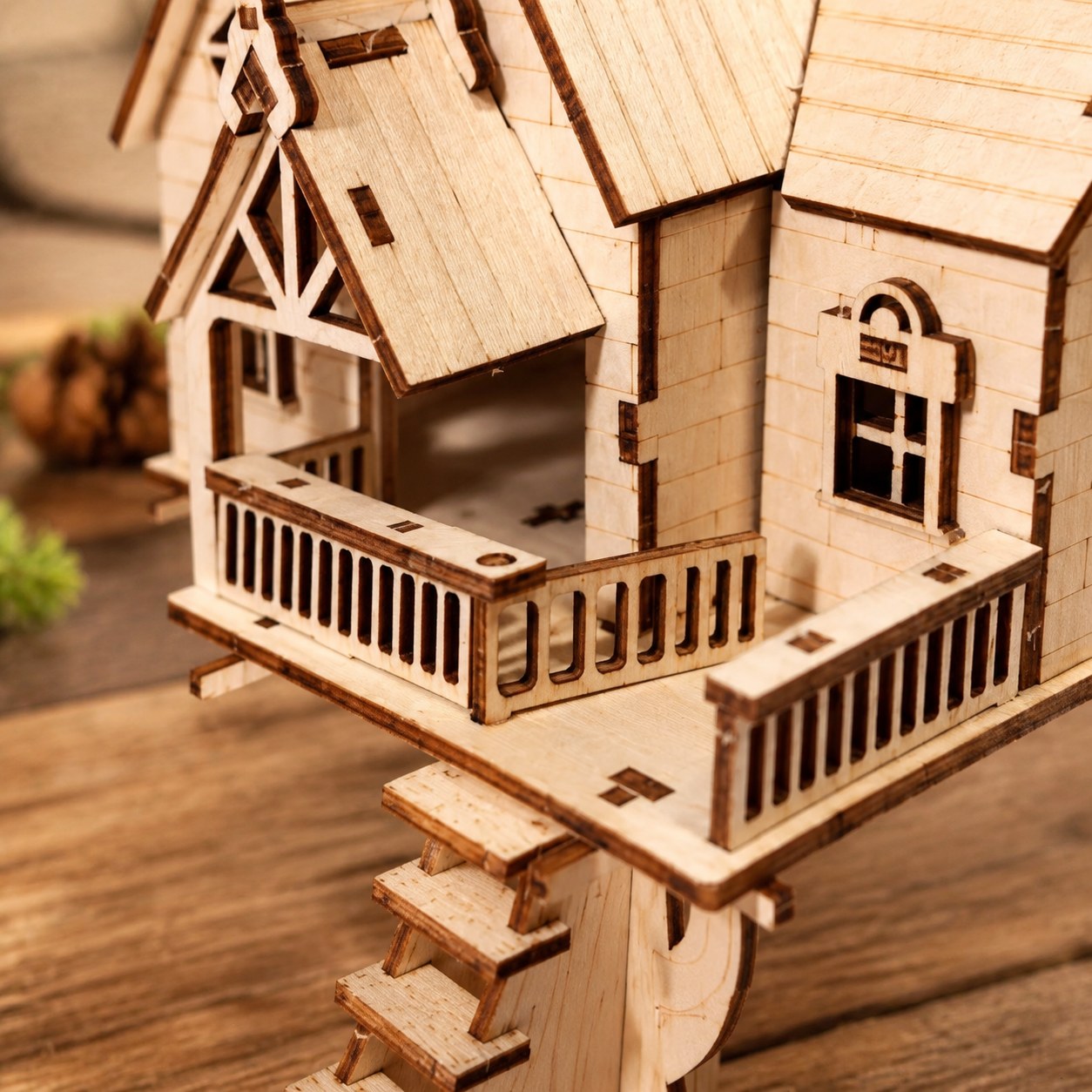 Close-up of laser-cut details on the wooden treehouse