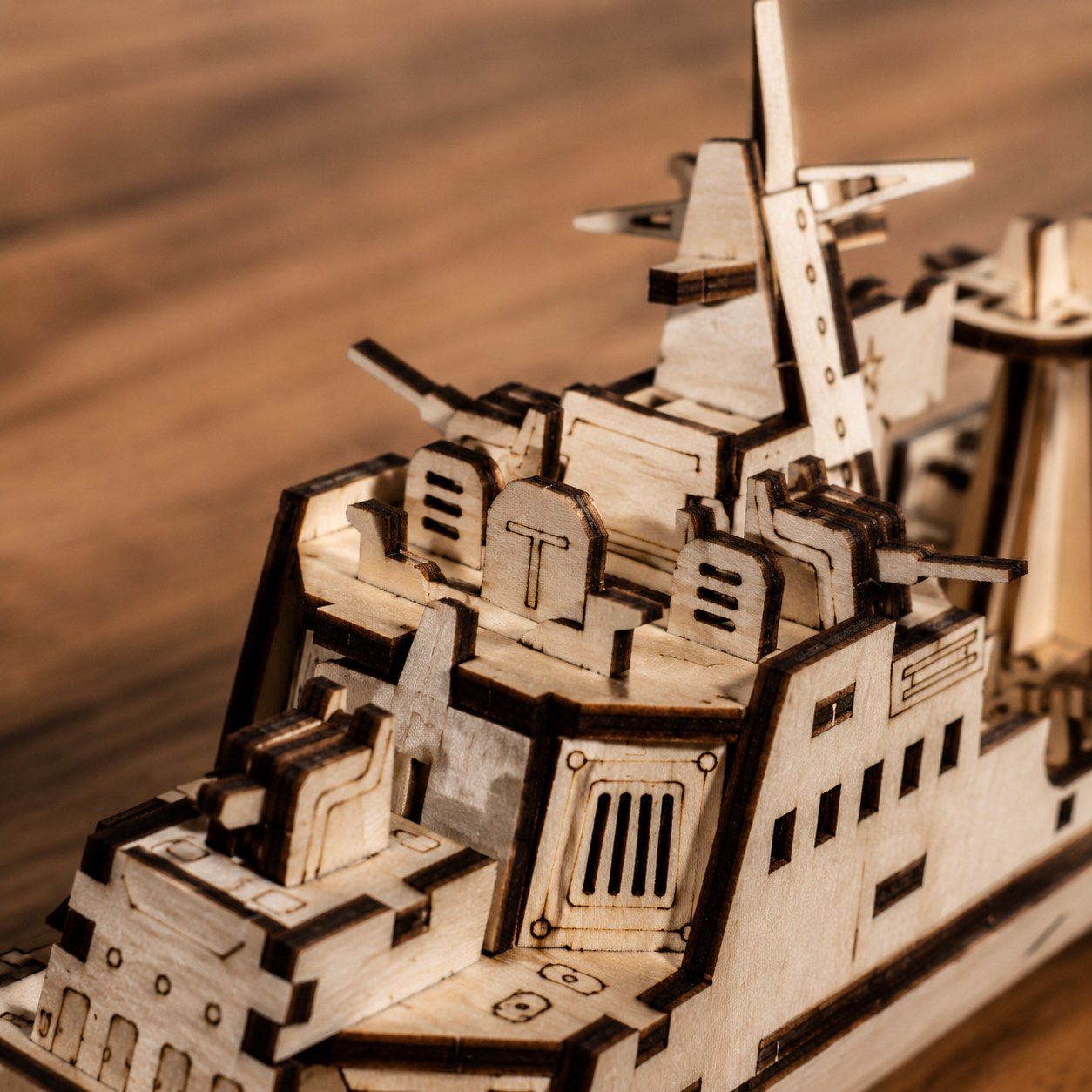 Macro close-up of the laser-cut details on the wooden warship puzzle