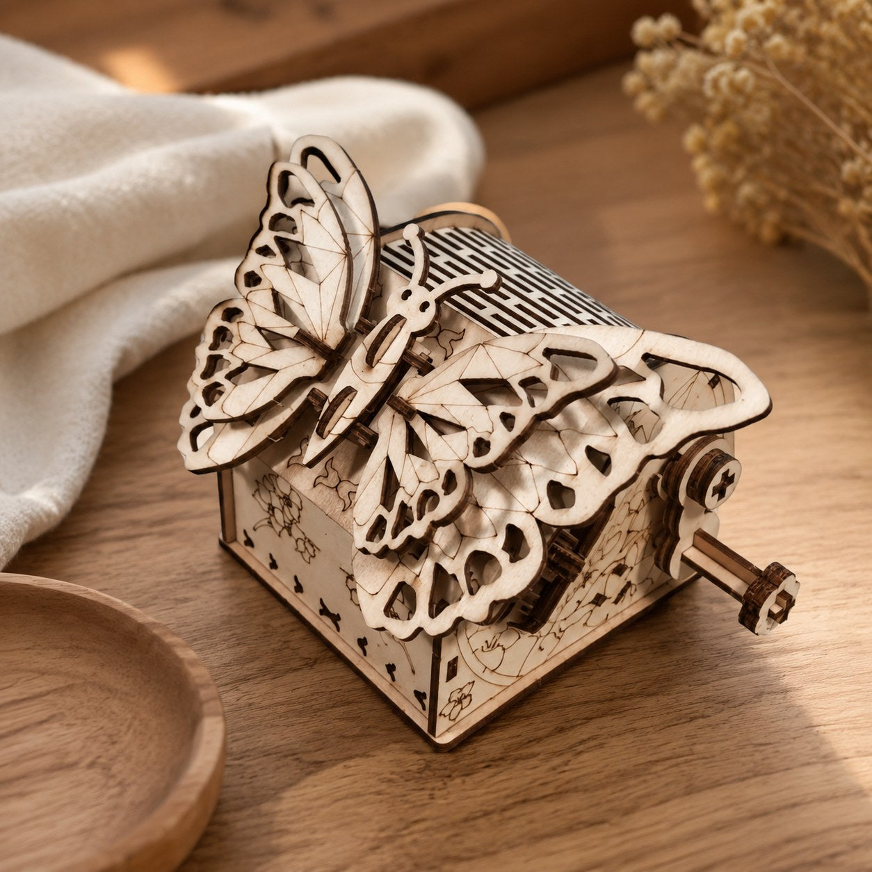 Close-up of laser-cut wooden gears and butterfly wings.