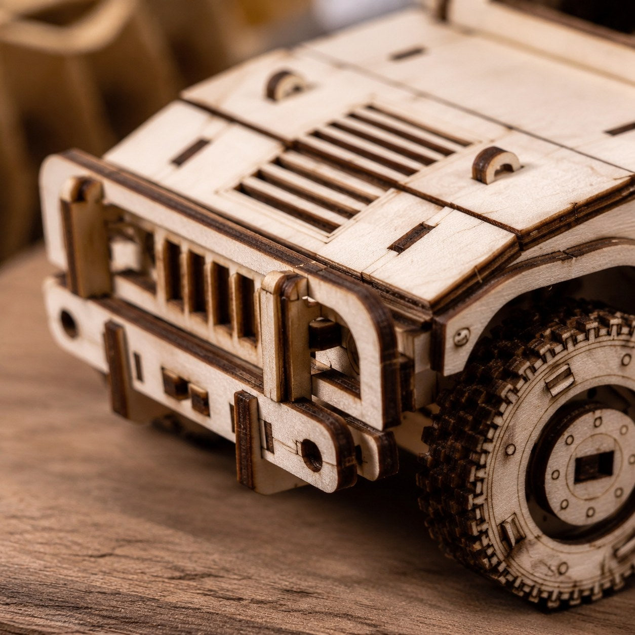 Macro close-up of the laser-cut wood grille on the off-road vehicle model