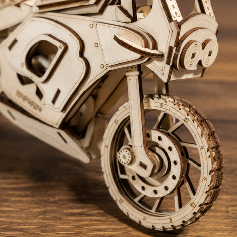 Macro close-up of the laser-cut wooden tire and engine details
