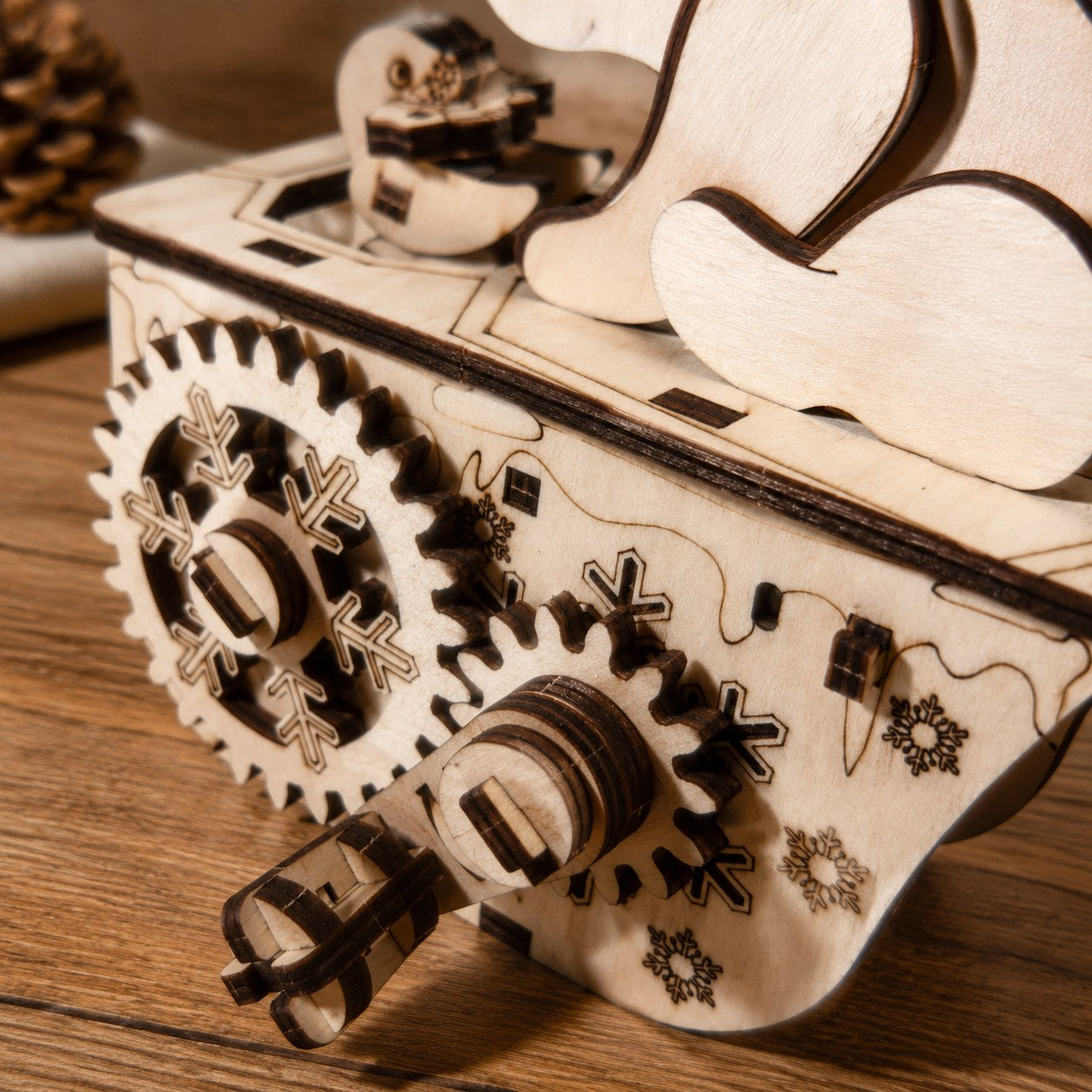 Macro close-up of the laser-cut snowflake gears on the Polar Bear 3D Wooden Puzzle