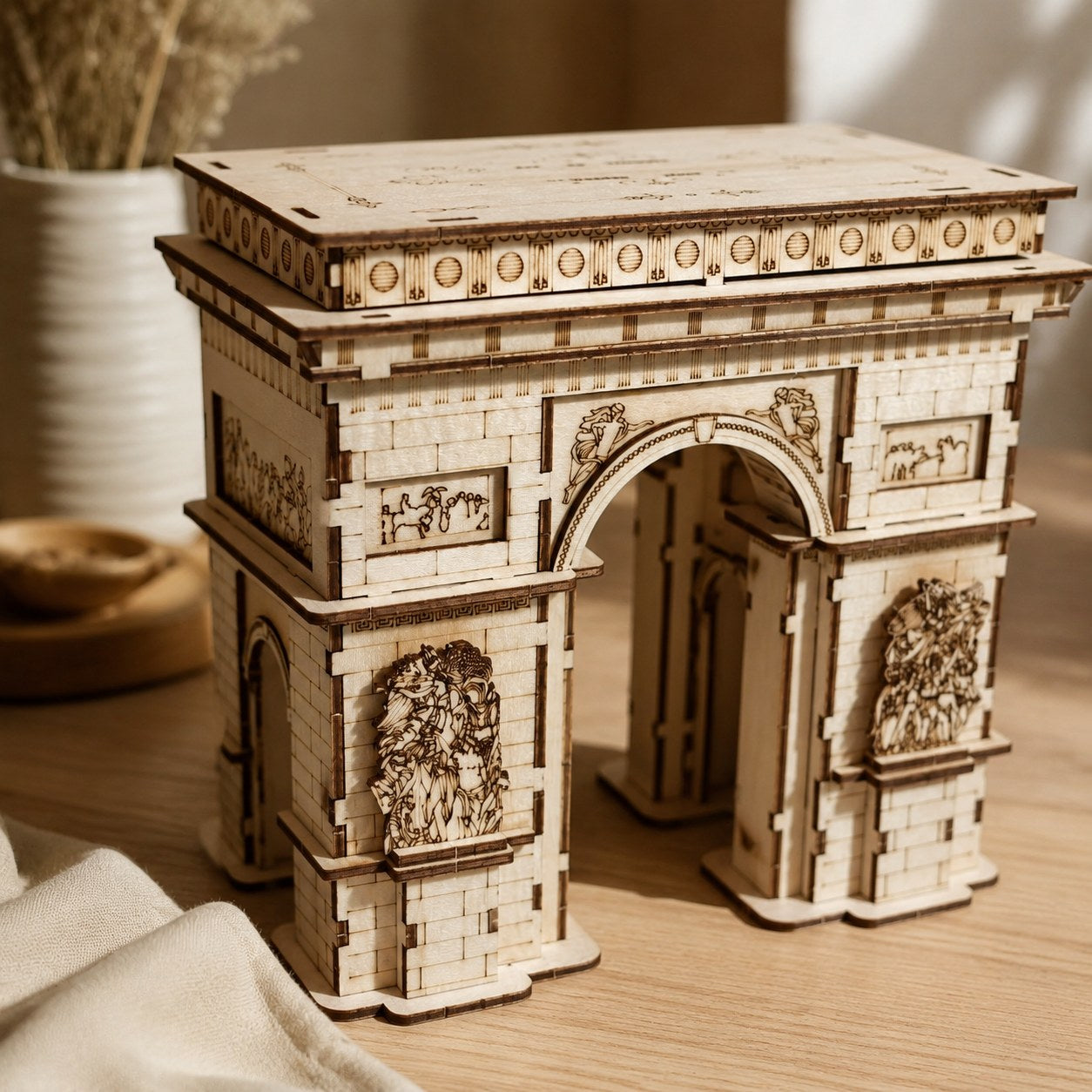 Close-up of laser-engraved details on the Arc de Triomphe wooden puzzle