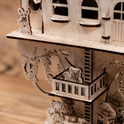 Close-up of laser-cut details on the 3D wooden treehouse