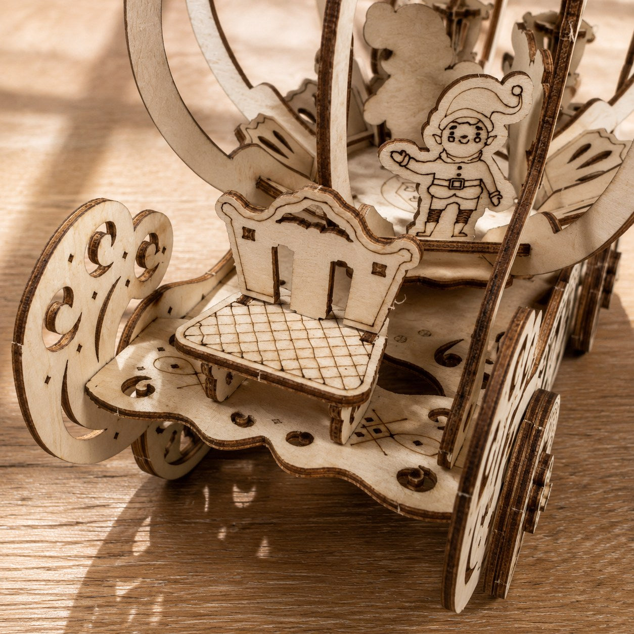 Close-up of laser-cut wood details on the carriage