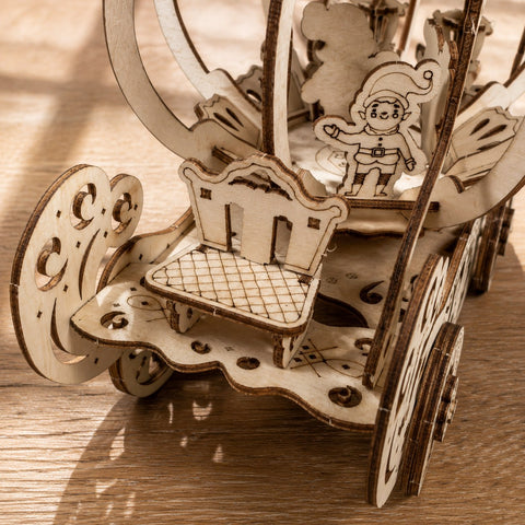 Close-up of laser-cut wood details on the carriage