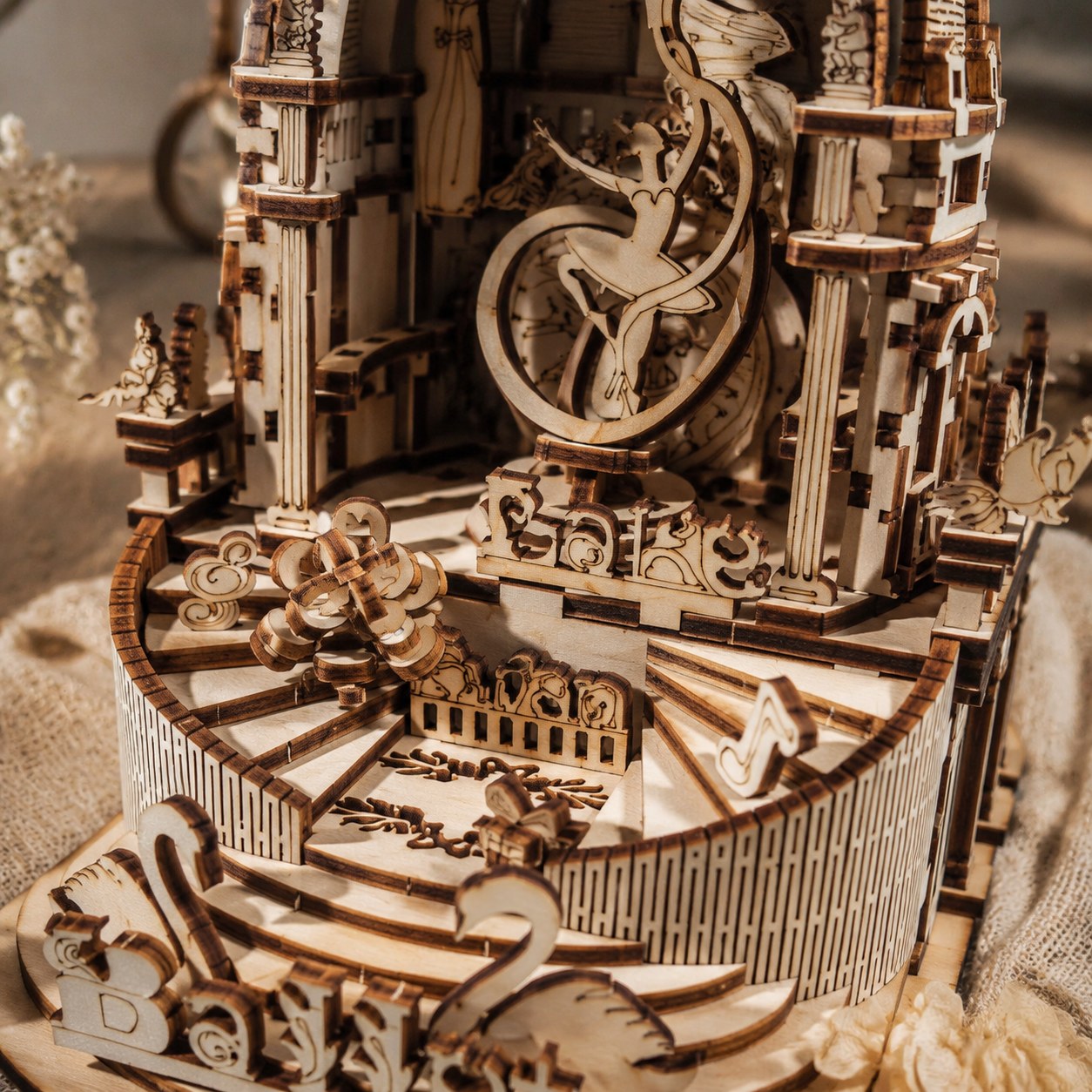 Macro close-up of the laser-cut ballerina and wooden details