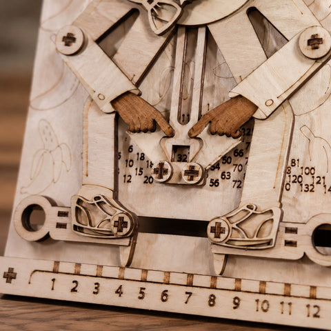 Close-up of the mechanical linkage and number window on the wooden puzzle