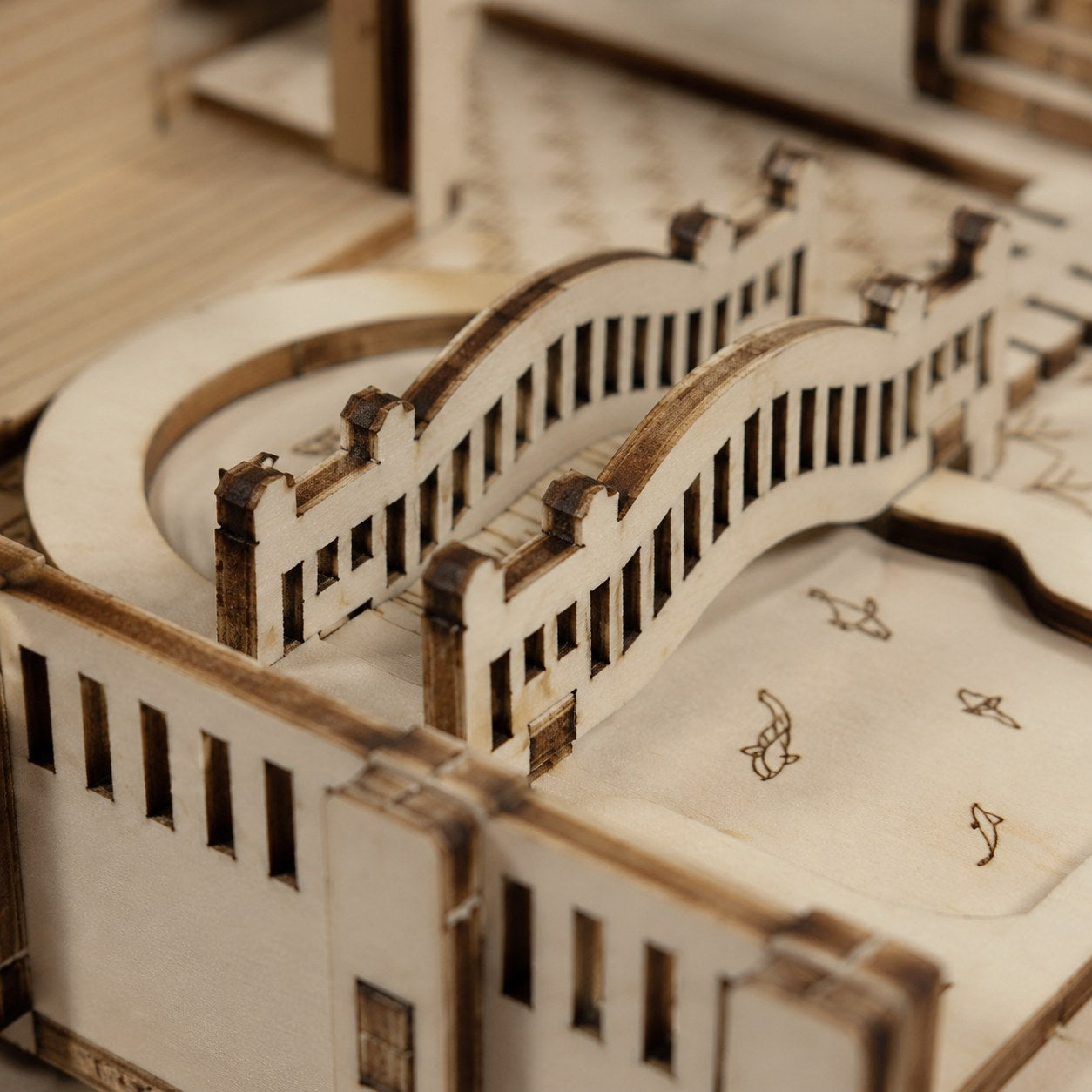 Close-up of laser-cut joints on the wooden puzzle bridge
